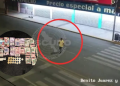 Surveillance still: a man in a yellow shirt is circled on a nighttime street; inset shows cash, coins, and a handgun as evidence note.