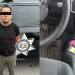 Man standing with hands behind back next to a police vehicle marked 'Policia Monterrey'—suspect in custody. The vehicle displays a badge and text emphasizing investigation.